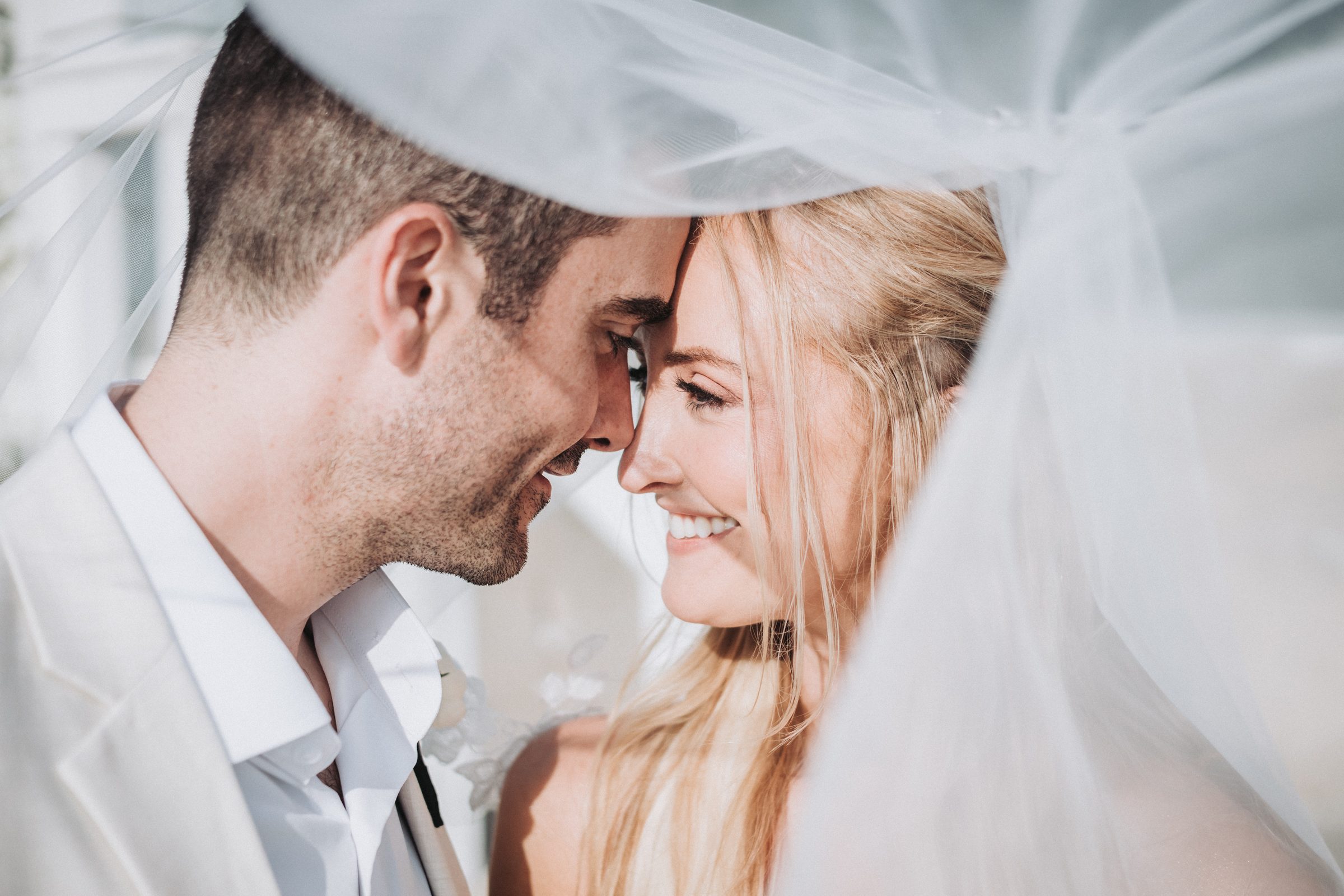 An emotional candid moment between a couple on their wedding day